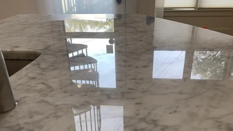 restored shiny marble countertop with reflections of room interior