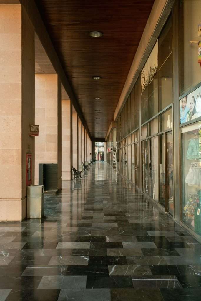 spacious modern mall corridor with glossy marble flooring