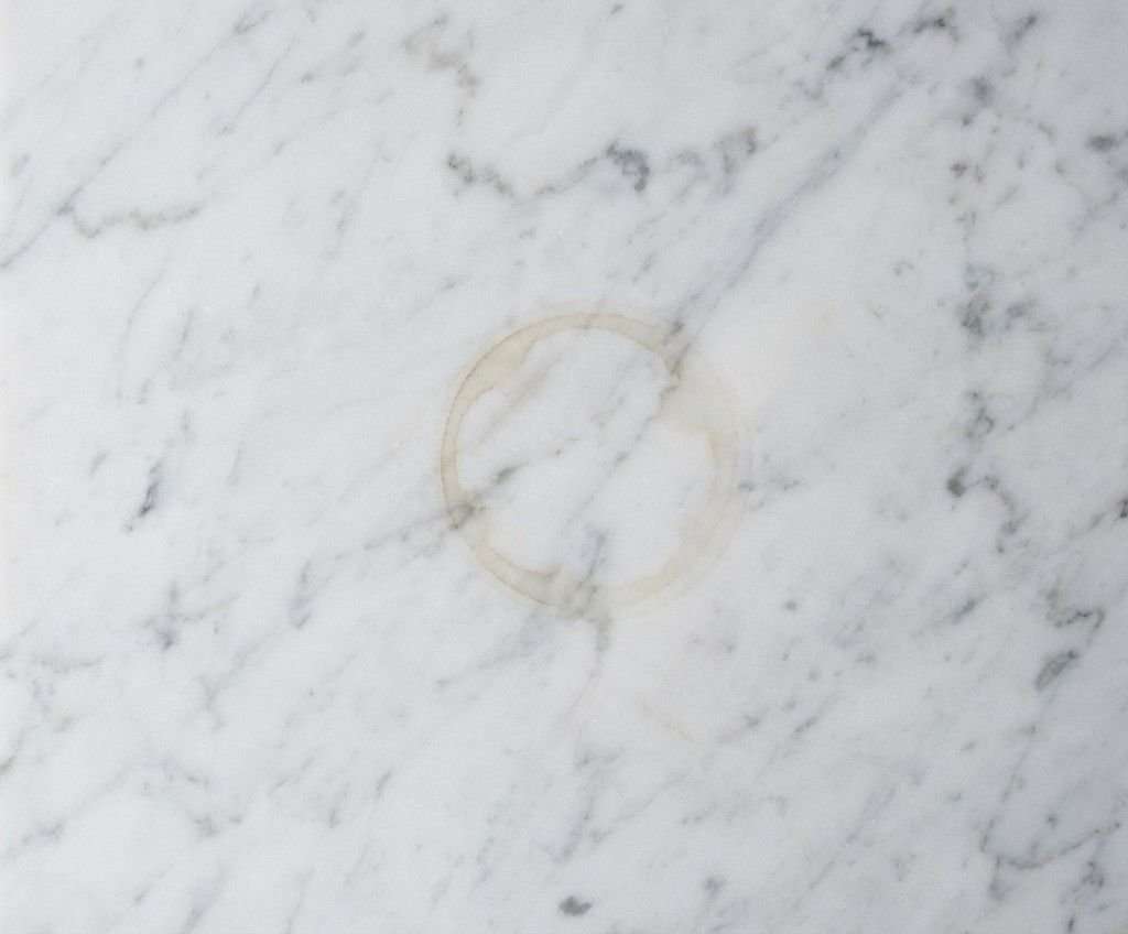 white marble countertop organic ring stain